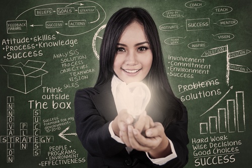 Woman with light-bulb and blackboard Woman with light-bulb and blackboard