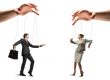 Business people as puppets