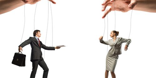 Pulling the strings Business people as puppets