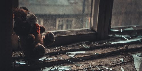 Distressed relationships teddy bear in a dismal scene