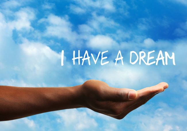 I have a dream! outstretched hand with cloudy sky