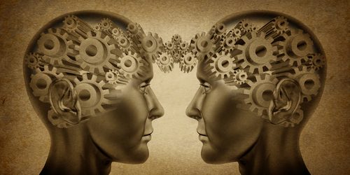 A meeting of minds Two heads with connected thought