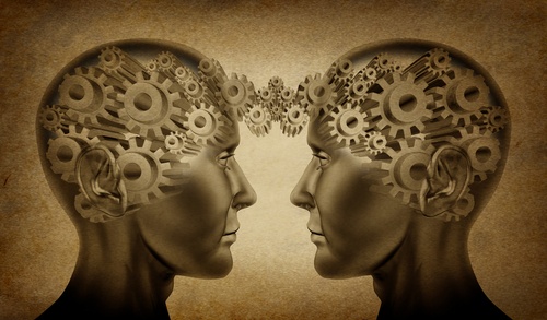 A meeting of minds Two heads with connected thought