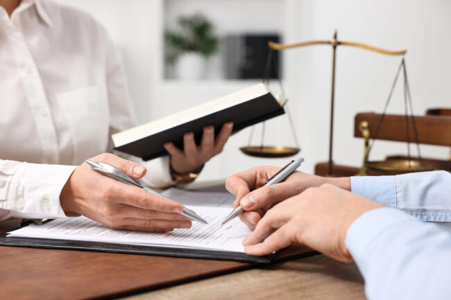 Expert and Lawyer working on a document